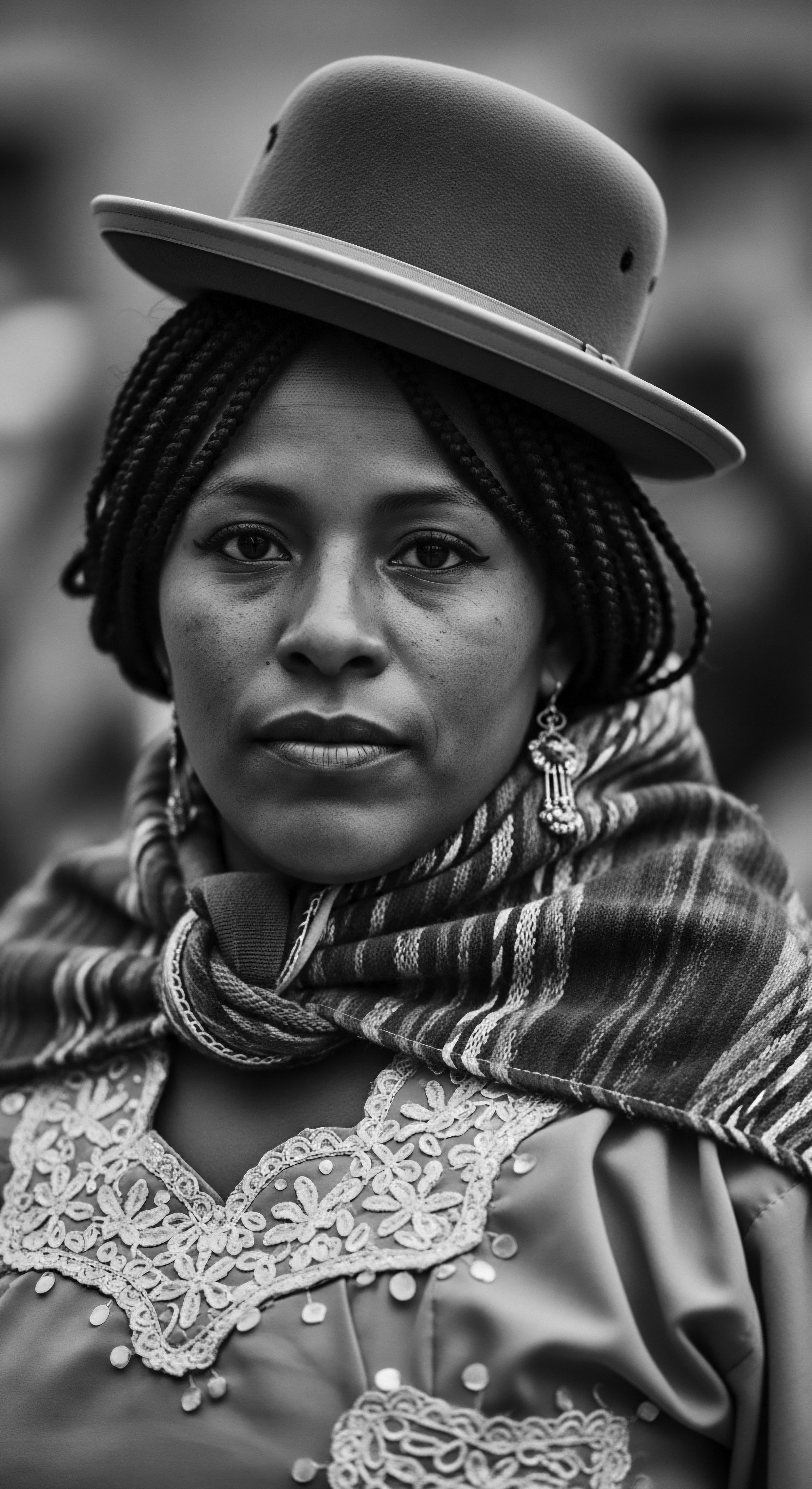 Andean Woman’s Braided Hair under Hat Reflects Cultural Identity and Resilience This portrait of an Andean woman, adorned with braids beneath her hat and traditional shawl, encapsulates resilience and heritage. The stark contrast emphasizes textured hair's beauty while reflecting on ancestral traditions, inviting contemplation on identity and cultural endurance.