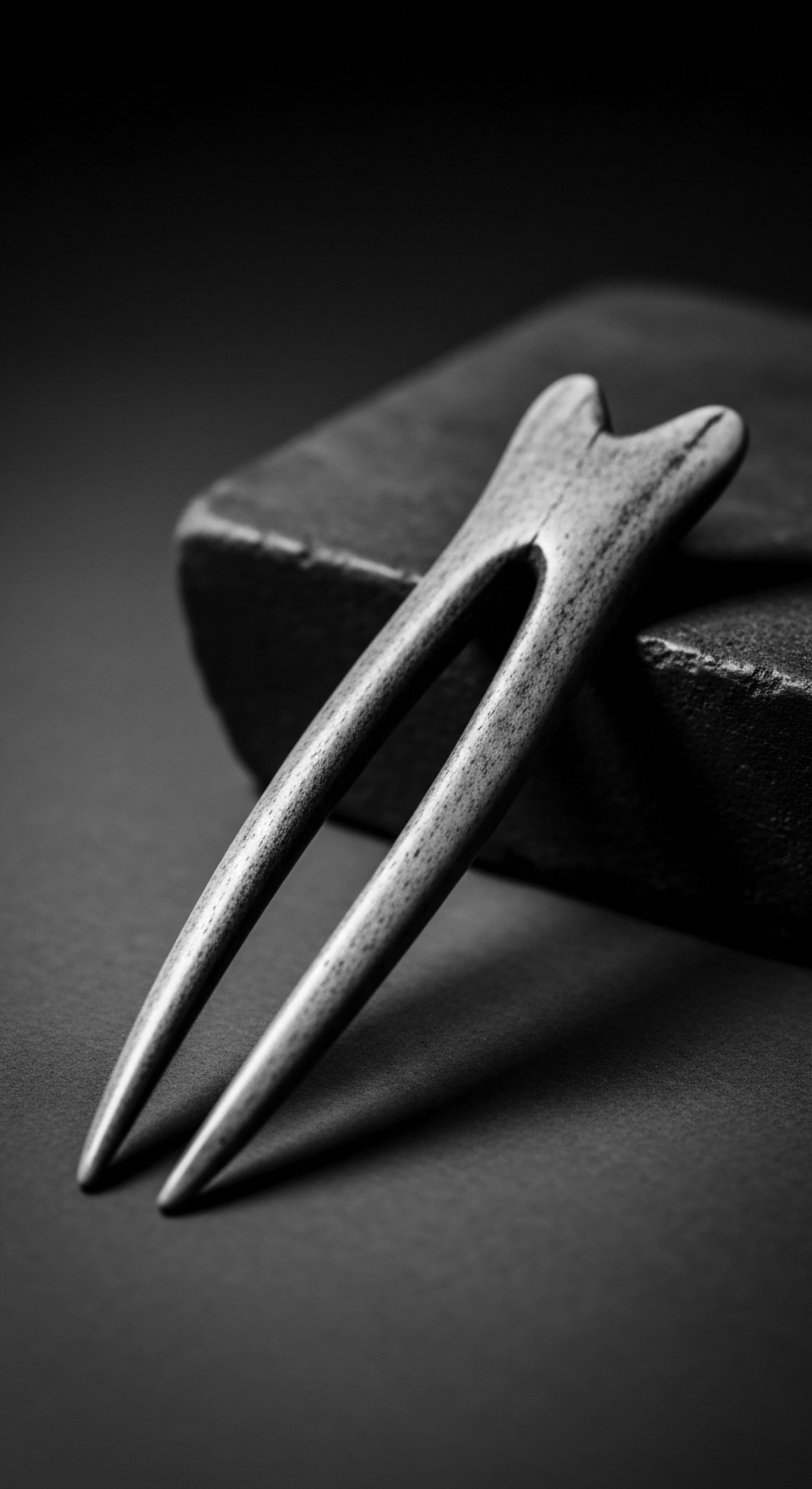 Artisan Crafted Wooden Hair Fork for Textured Hair Holistic Care Rituals Echoing ancestral beauty rituals, the wooden hair fork signifies a commitment to holistic textured hair care. The monochromatic palette accentuates the timeless elegance, connecting contemporary styling with heritage and promoting wellness through mindful adornment for diverse black hair textures.