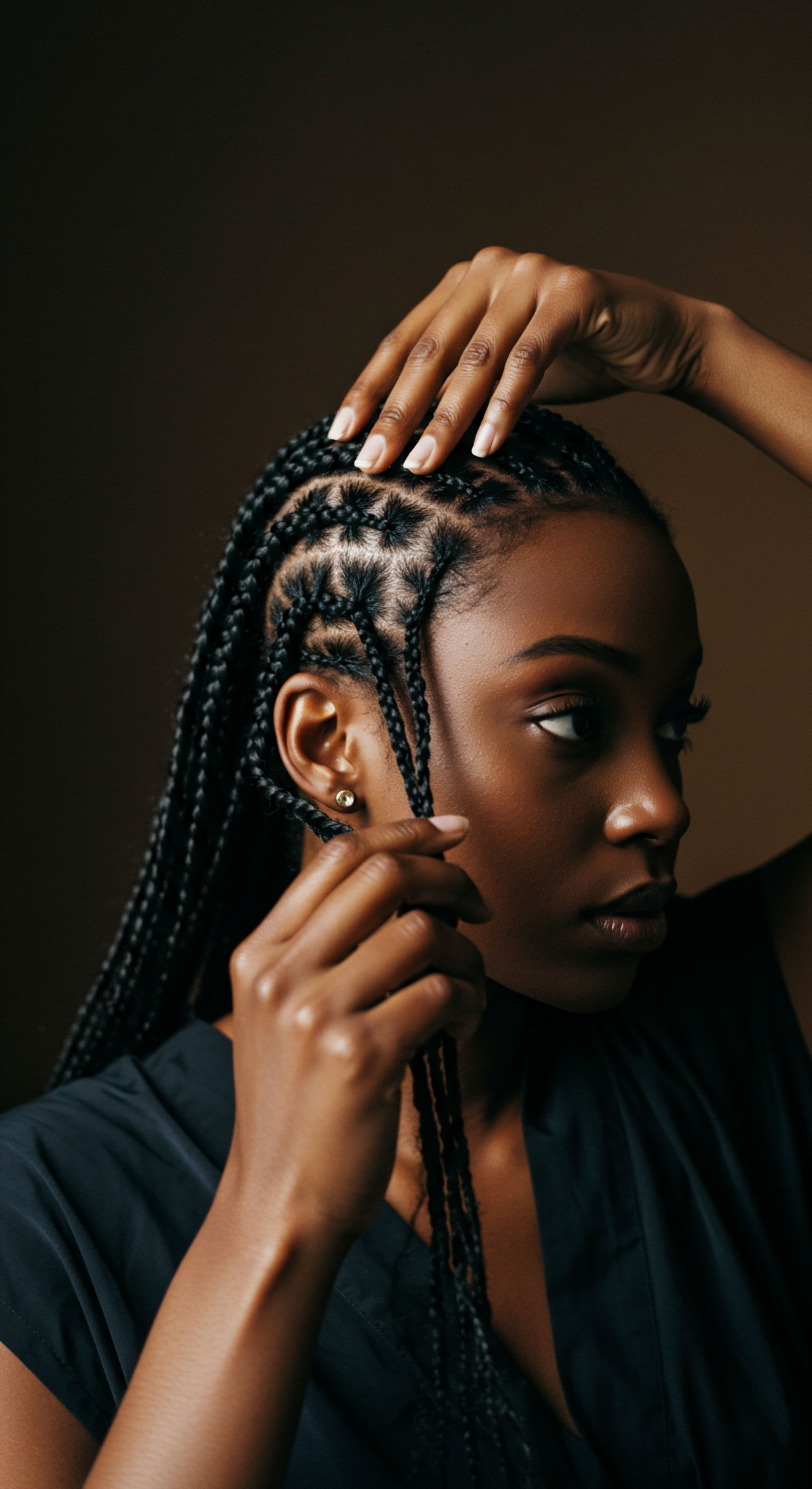 Black Hair Protective Styles Ancestral Braiding Care And Definition Honoring Black Hair heritage, this portrait reveals masterful protective styles through intricate braiding techniques on coily hair. Attentive scalp care and hair nourishment ensure optimal hair integrity, embodying ancestral styling and magnificent texture definition.