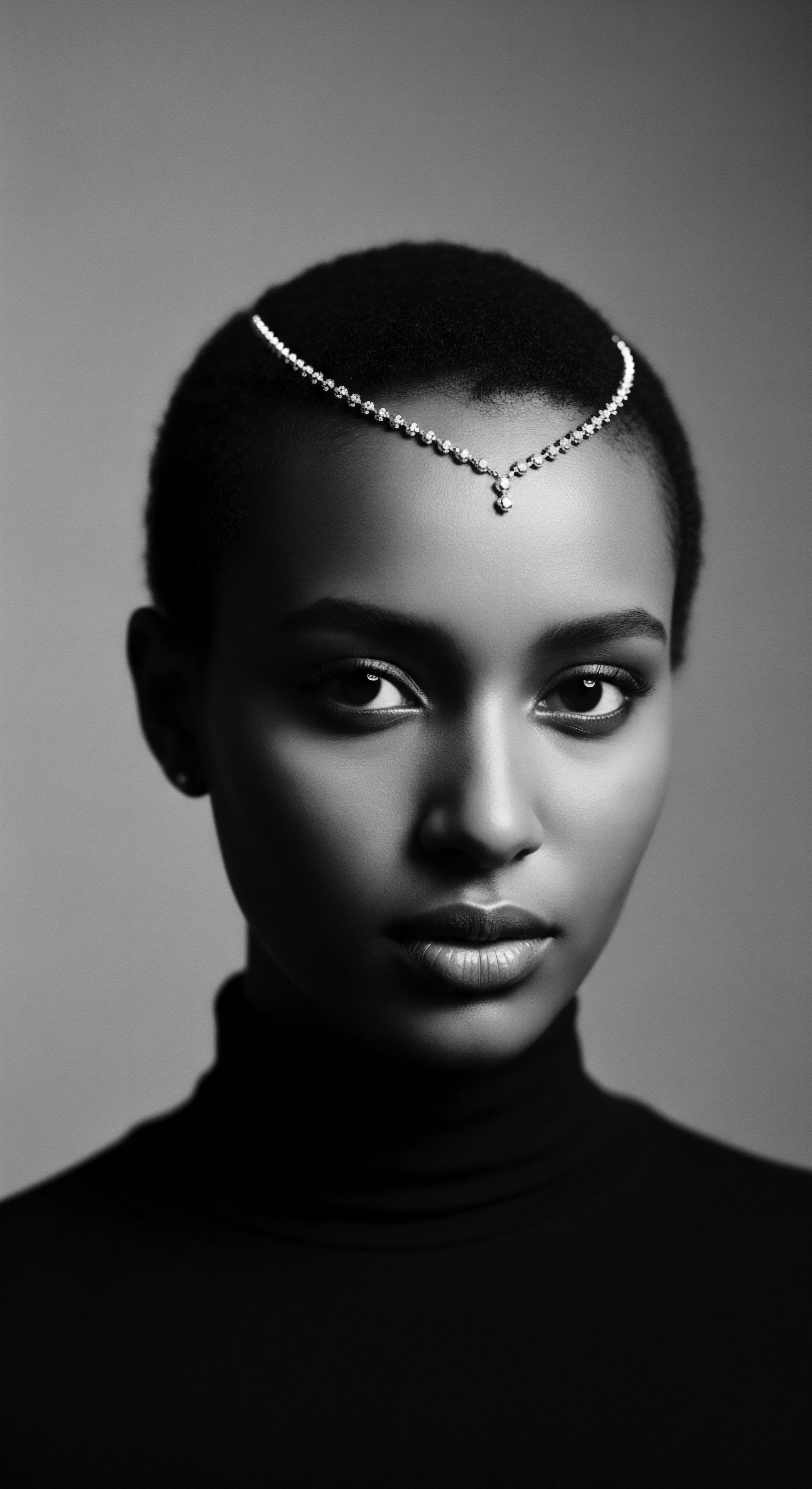 Elegant Portrait of a Woman Adorned with a Diamond Headpiece This portrait celebrates the intersection of contemporary elegance and natural Black hair traditions, showcasing a striking individual whose aesthetic choices enhance both her heritage and personal style, symbolizing a harmonious blend of ancestral legacy and modern self-expression through considered adornment.