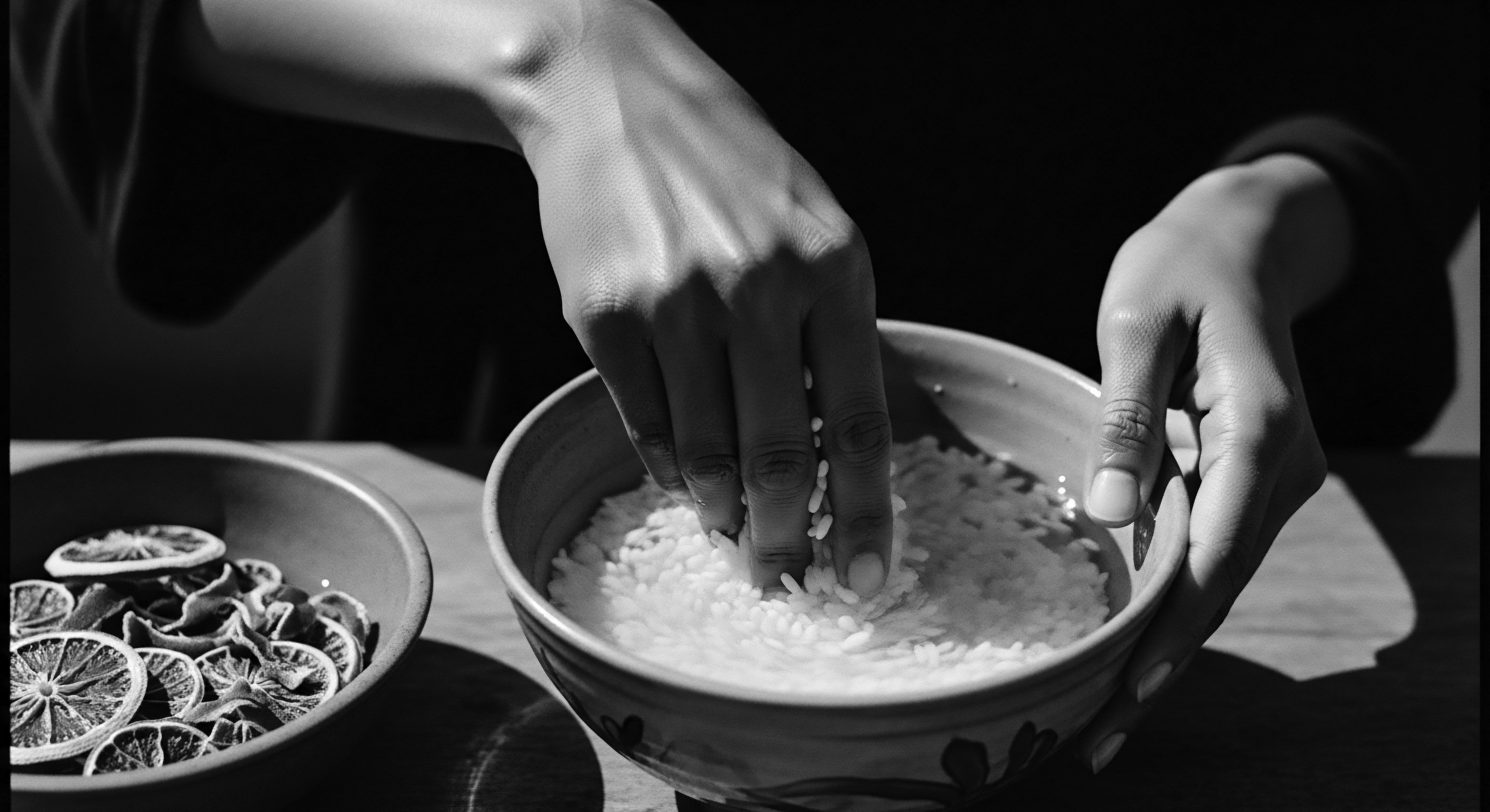 Hands Washing Rice for Textured Hair Rinse Holistic Ancestral Practice Embracing ancestral wisdom, the hands prepare a rice water rinse, a treasured holistic practice for enhancing textured hair's strength and vitality this highlights the intrinsic link between hair care, heritage, and the nurturing of expressive identity within Black and mixed-race hair traditions.