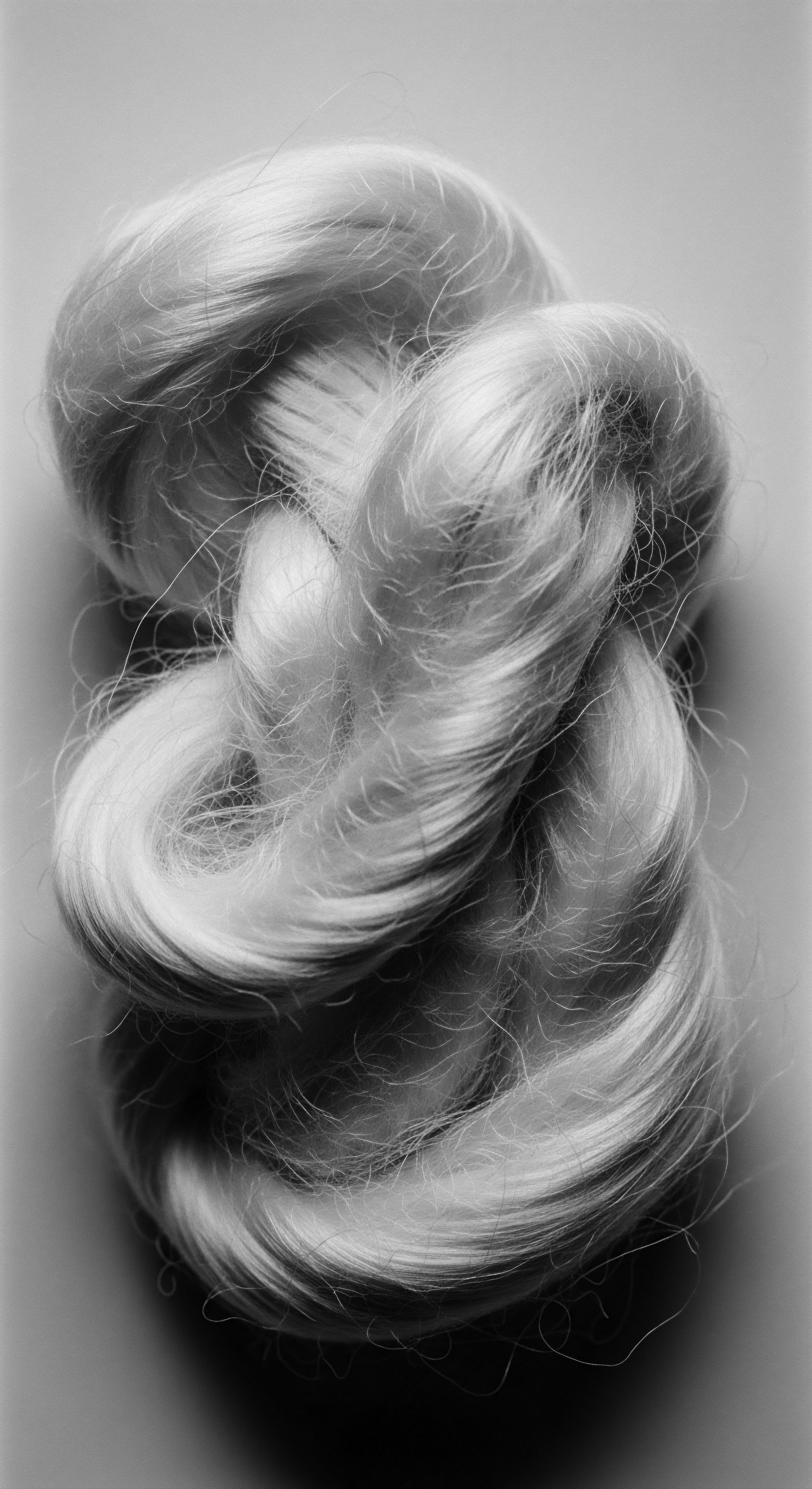 Monochrome Abstract Textured Hair Formations Reflecting Light and Shadow The intricate monochrome textured hair formations suggest strength, resilience, and beauty. Light and shadow interplay to highlight unique undulations, reflective of ancestral pride and meticulous hair wellness routines. These artful forms evoke cultural heritage, community, and a commitment to holistic textured hair care.