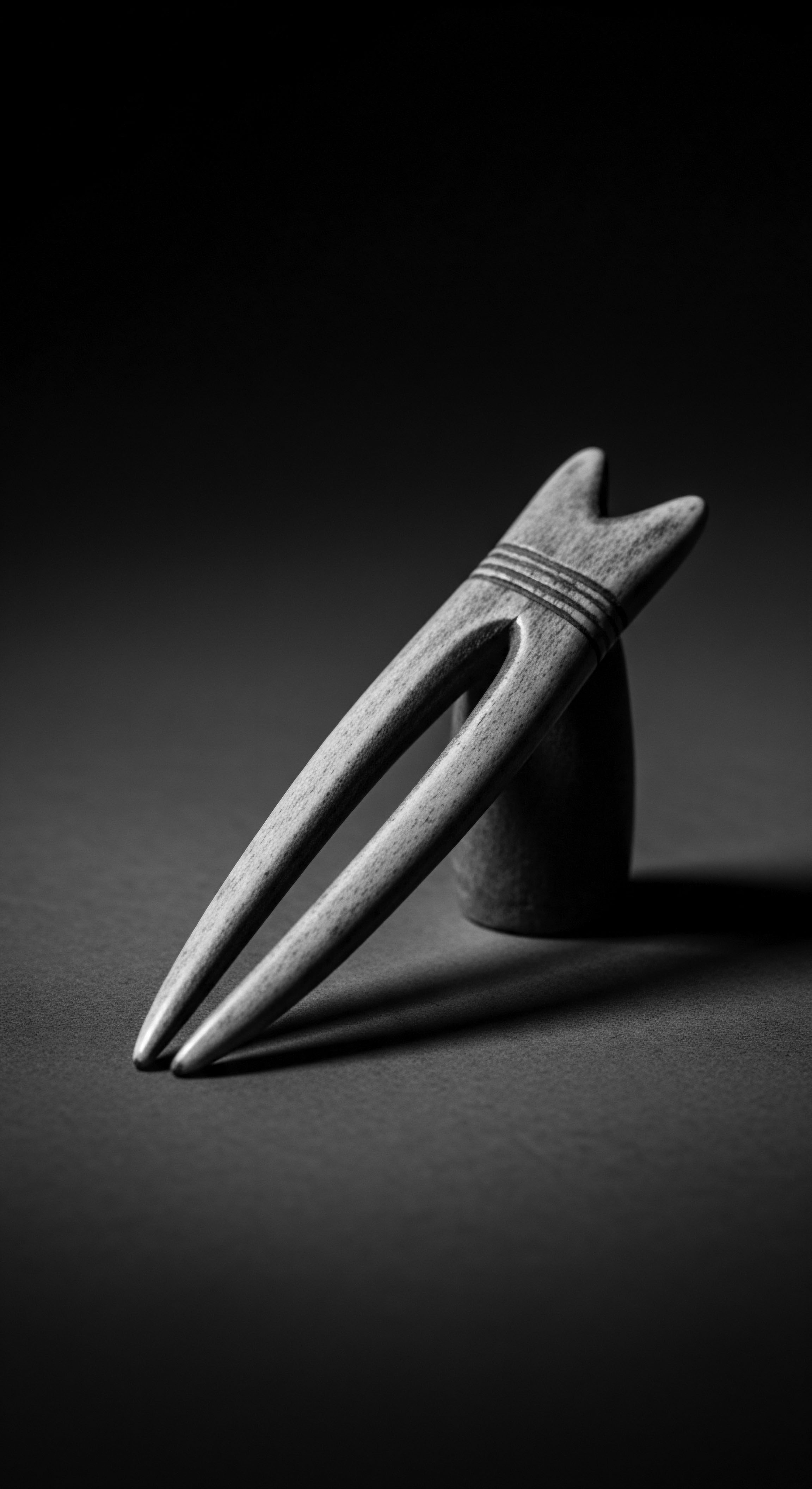 Monochrome Wood Hair Fork: Heritage Styling in Black and White Captured in monochrome, the wood hair fork embodies the intersection of tradition and modern design. A symbolic nod to ancestral heritage styling, this handcrafted piece resonates with contemporary holistic care, preserving the legacy of textured hair through artful form and mindful practices.