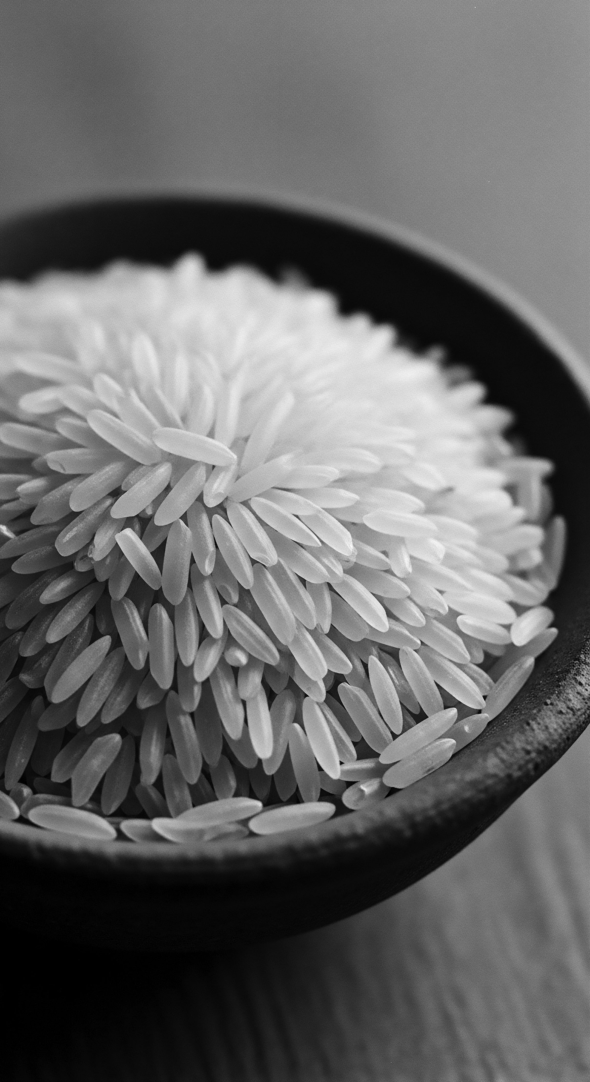 Pristine Rice Grains Detail Basmati Type for Hair Wellness Products The photograph explores the use of rice grains, highlighting their inherent qualities conducive to holistic wellness, invoking notions of ancestral heritage and the rich benefits of natural elements present in wellness treatments that could support the essence of natural hair.