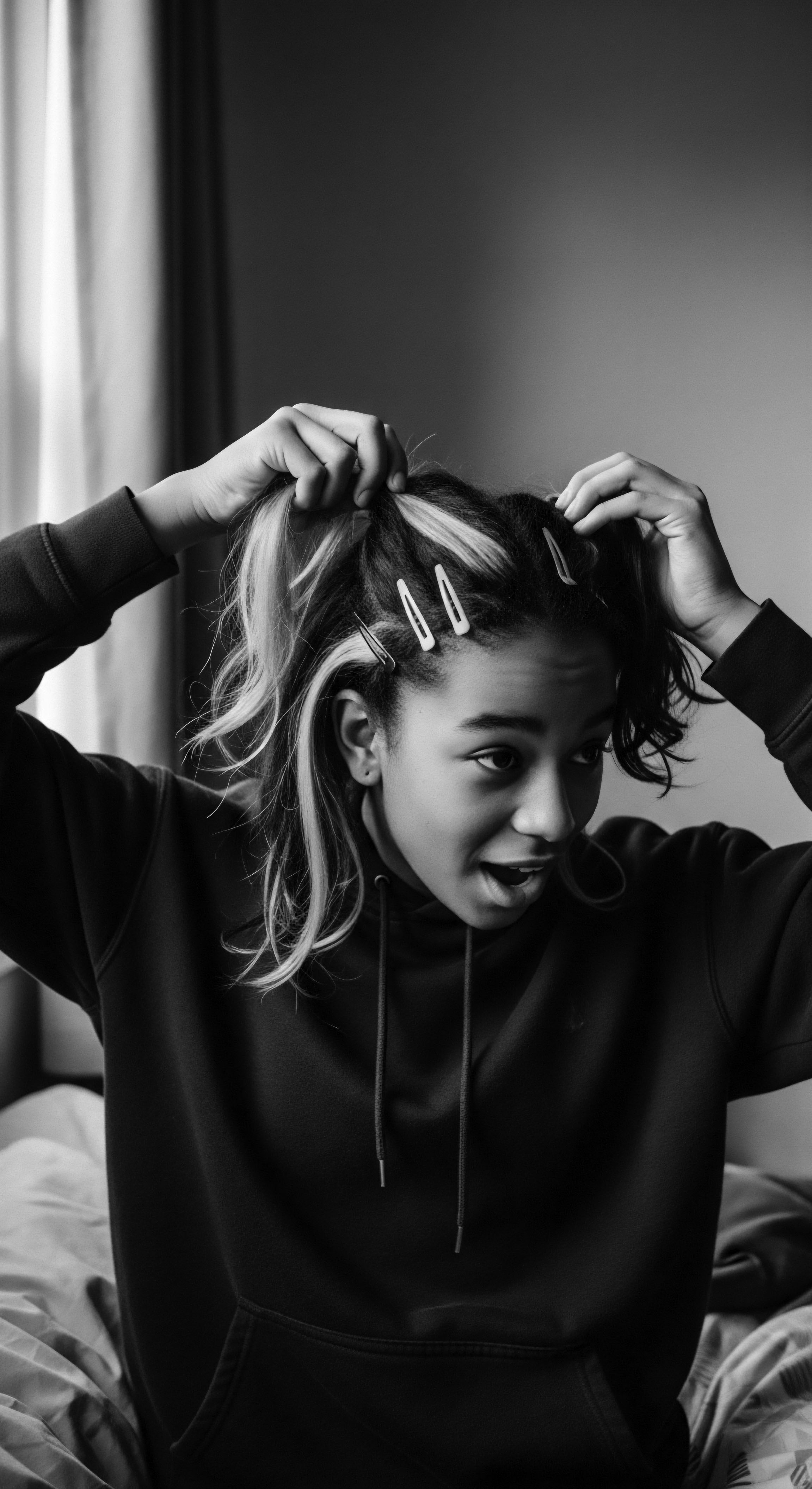 Youthful Expression Securing Textured Hair With Barrettes Styling in Black and White Captured in monochrome, this striking image showcases the art of self-expression through textured hair styling with clips, embodying a blend of cultural heritage and modern flair. The composition highlights the individual's exploration of identity via unique hair texture and form, and the embrace of their distinctive hair pattern.
